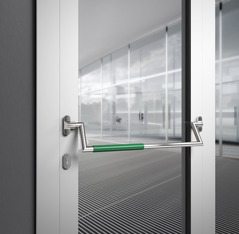 Panic bar on a public building door made of matt polished stainless steel with green polyamide handle tube