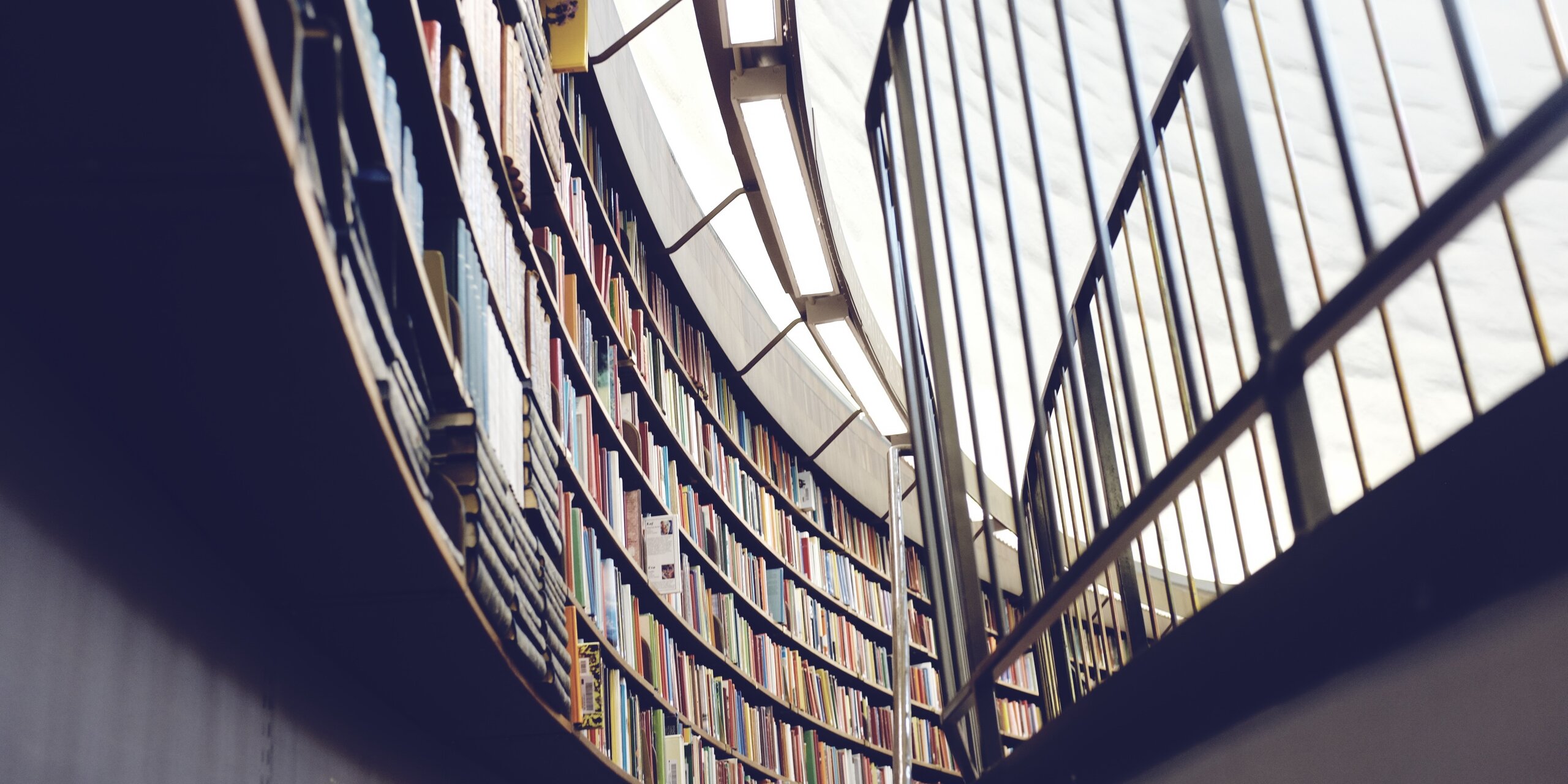 Library with a rounded wall full of books